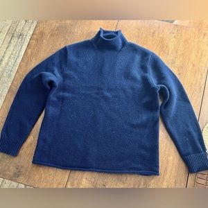 A men’s J. Crew Always roll neck sweater in medium.